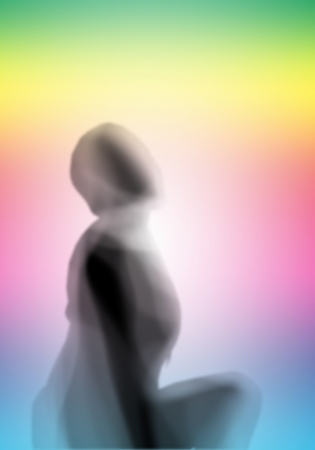 Image with a blurred female silhouette against colour backgroundの写真素材