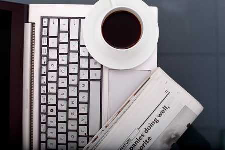 Image of business table with a cup of coffee and norebook