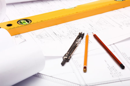 Tools and papers with sketches on the table