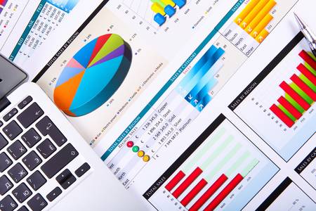 Financial paper charts and graphs on the tableの写真素材