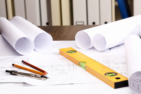 Tools and papers with sketches on the table