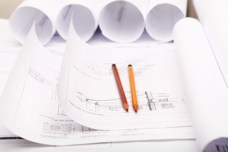 Tools and papers with sketches on the table