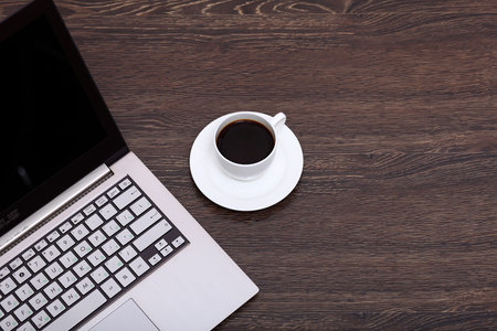 White cup with black coffee at business workplaceの写真素材