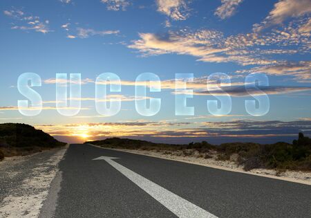 Image of road with white arrow directing forwardの写真素材