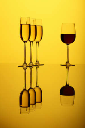 Glasses with wine on the color backgroundの写真素材