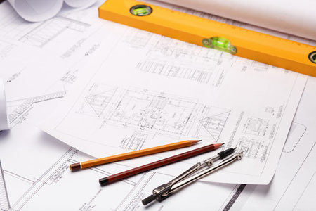 Tools and papers with sketches on the table