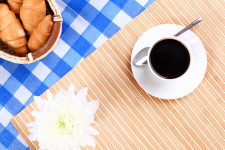 Continental breakfast with croisant and black coffeeの写真素材