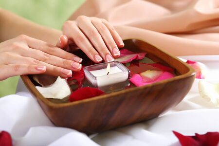Female hands and manicure related objects in spa salonの写真素材