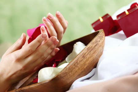 Female hands and manicure related objects in spa salonの写真素材