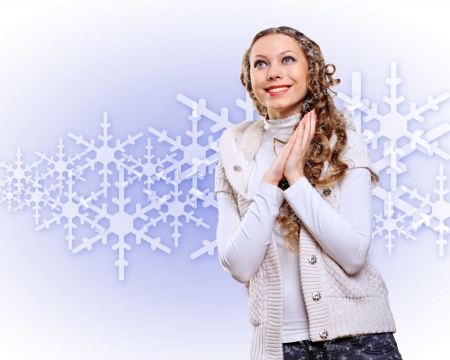 Young pretty woman with lomng hair wearing warm pulloverの写真素材