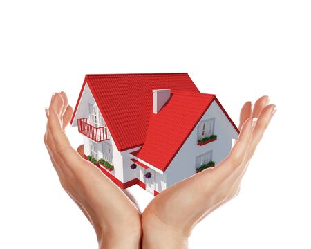 The house with colour roof in human handsの写真素材