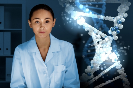 Image of DNA strand against colour backgroundの写真素材