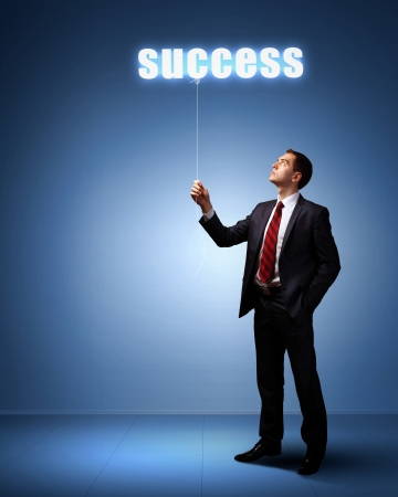 Light bulb and a business person as symbols of creativity in businessの写真素材
