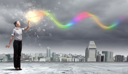 Image of a business man standing against cityscapeの写真素材