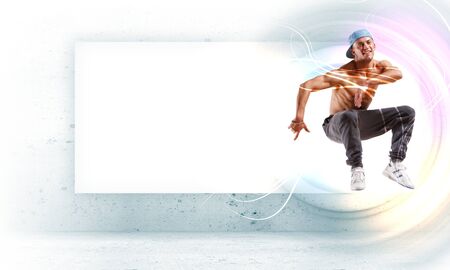 young man in a blue cap dancing hip hop - collage with place for textの写真素材