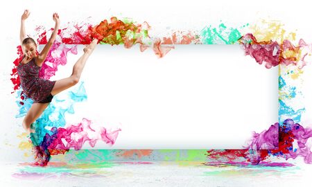 Girl dancing in a color dress with a gray background  Collage with place for textの写真素材