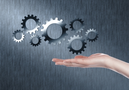 Image with machinery gears and human handの写真素材