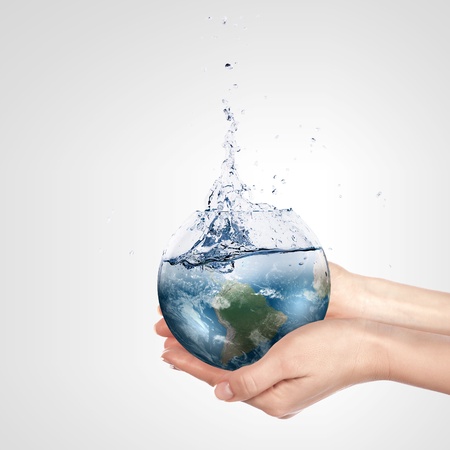 Globe in human hand against blue sky  Environmental protection concept  Elements of this image furnished by NASAの写真素材