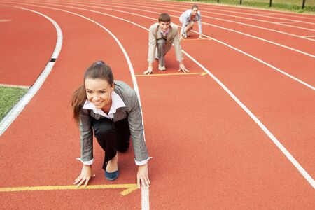 Businesswoman at athletic stadium and race trackの写真素材