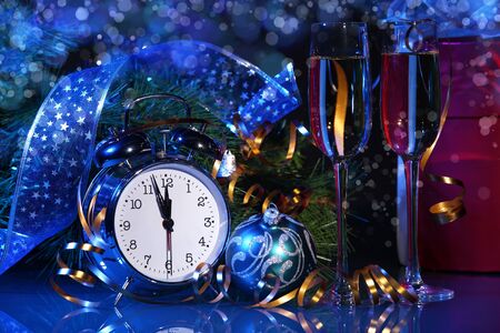 New Year s collage with glasses of champagne  Decorations and ribbons on a bright color backgroundの写真素材