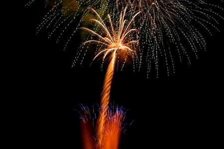 Colorful fireworks on the black sky backgroundの写真素材