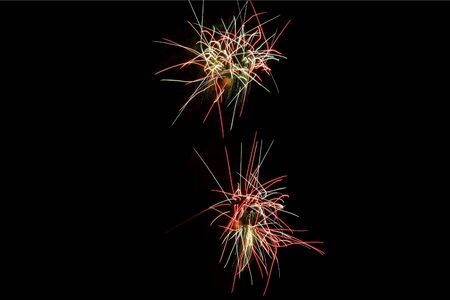 Colorful fireworks on the black sky backgroundの写真素材