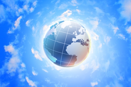 Planet earth against blue cloudy sky backgroundの写真素材