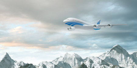 White passenger plane flying in the blue sky above the mountains with snow tops