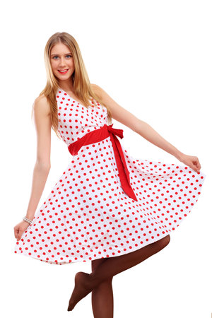 Beautiful young blond woman in red dressの写真素材