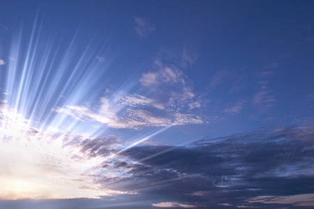 Dark clouds with sun rays over sea 