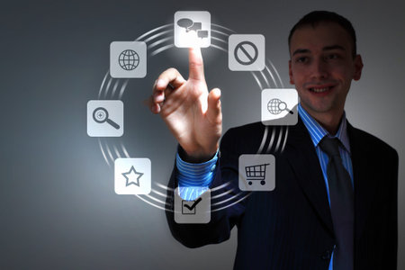 Business person pushing symbols on a touch screen interface