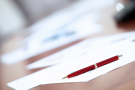 Image of a business work place with papers on the tableの写真素材