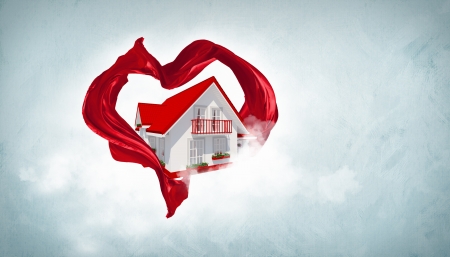 House withing a red heart symbol from fabriqueの写真素材