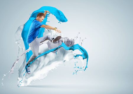 Modern style dancer jumping and paint splashes Illustrationの写真素材