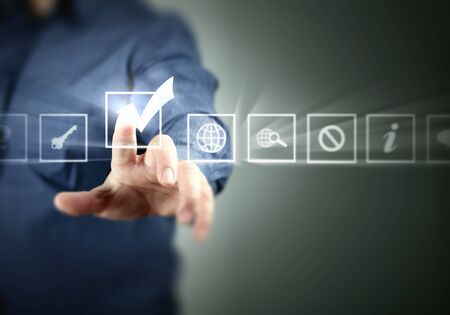 Hand pressing abstract virtual buttons on touchscreenの写真素材