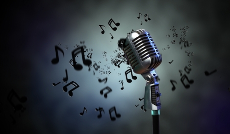 Single retro microphone against dark background with music notesの写真素材