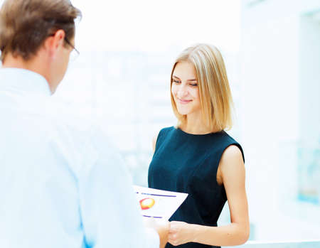 Two young business collegue working together in officeの写真素材