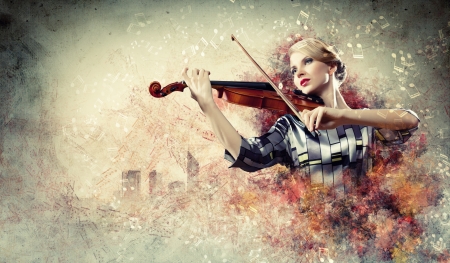 Image of beautiful female violinist playing with against colorful backgroundの写真素材