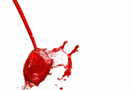 the red Juice splash isolated on whiteの写真素材