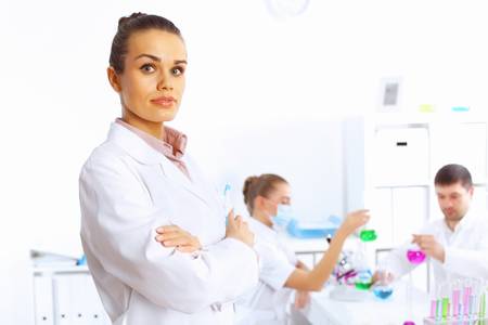 Team of scientists working with liquids in laboratoryの写真素材