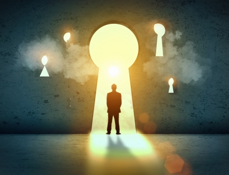 Silhouette of businessman standing in keyhole sun shining aboveの写真素材