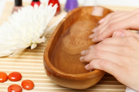 Young woman is getting manicure in a beauty salonの写真素材