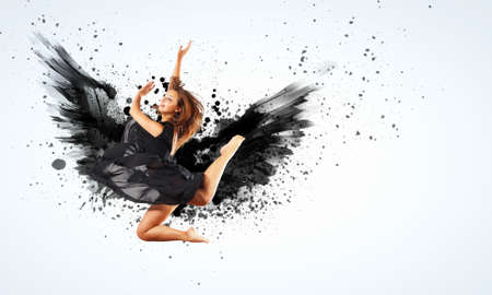 Woman floating in a dance on dark wings  Collage の写真素材
