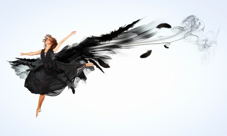 Woman floating in a dance on dark wings  Collage の写真素材