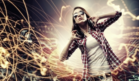 Young girl listens to music  Modulations of color and light の写真素材