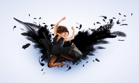 Woman floating in a dance on dark wings  Collage の写真素材