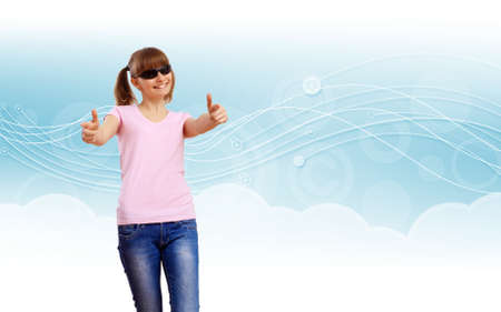 Happy smiling girl dancing and listening to musicの写真素材