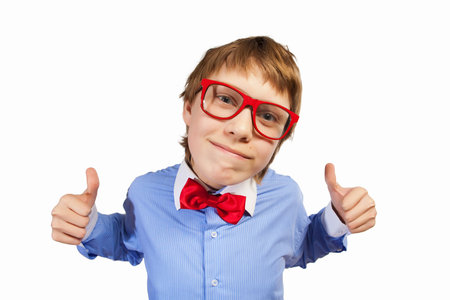 Image of schoolboy smiling showing thumbs up