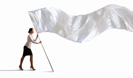 Image of attractive businesswoman holding white flag  Place for textの写真素材