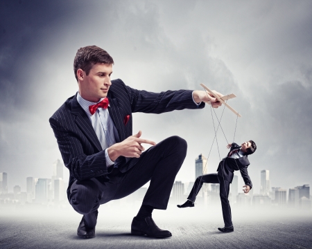 Image of young businessman puppeteer  Leadership conceptの写真素材